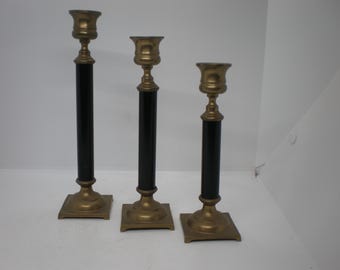 Set of Three Black and Brass Candlesticks