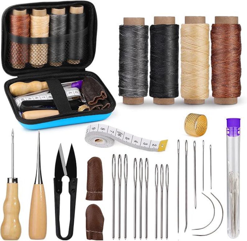 May include: A leathercrafting kit with various tools and supplies. Includes spools of thread, needles, scissors, a thimble, a measuring tape, and a blue zippered case containing additional tools and thread.