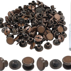 May include: A collection of bronze-colored metal screw-back rivets with circular heads and threaded posts, accompanied by a small screwdriver with a clear plastic handle. The rivets feature a cross-head slot on the back for tightening.