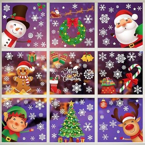 May include: A festive window cling set featuring various Christmas-themed images. Includes a snowman, Santa Claus, a gingerbread man, an elf, a reindeer, a Christmas tree, a wreath, snowflakes, and the words "Merry Christmas". The background is a deep purple.