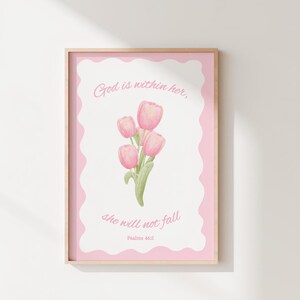 May include: A framed print featuring a watercolor illustration of pink tulips. The artwork includes the text "God is within her, she will not fall" and "Psalms 46:5" in a soft, cursive font, set against a pink and white background.