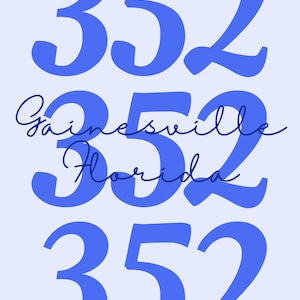 May include: A light blue graphic design on a light blue background. The design features the numbers "352" in a bold font, with the word "Gainesville Florida" in a cursive font between the numbers.