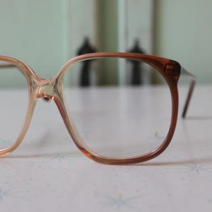Vintage JACKIE O Glasses..new old stock. classic. groovy. twiggy. mod. retro glasses. librarian. secretary. woodstock. oversized. brown. tan
