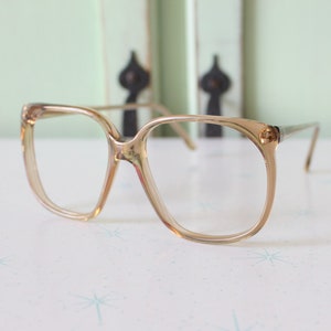 Vintage JACKIE O Glasses..new old stock. classic. groovy. twiggy. mod. retro glasses. librarian. secretary. woodstock. oversized. brown