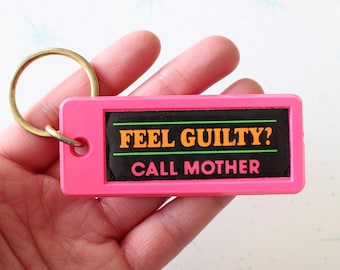 Vintage NEW OLD STOCK Comical Keychain.....collectible. 1980s. retro. neon keychain. birthday. feel guilty call mother. gag gift. neon. pink