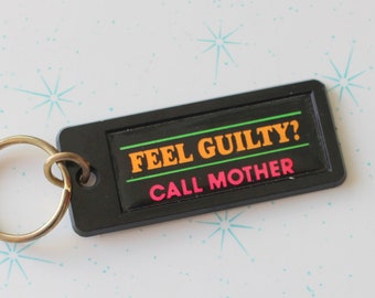 Vintage NEW OLD STOCK Comical Keychain.....collectible. 1980s. retro. neon keychain. birthday. feel guilty call mother. gag gift. neon. pink