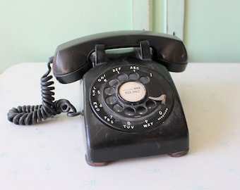 Telefone giratório preto dos anos 1960: decoração retrô para casa