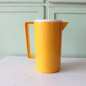 Vintage Yellow Plastic Juice Pitcher: Retro Kitchenware