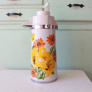 Vintage Floral Thermos: Retro Orange & Yellow Kitchen Decor