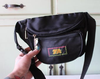 Zwart vintage heuptasje jaren 80: neon rad retrotas