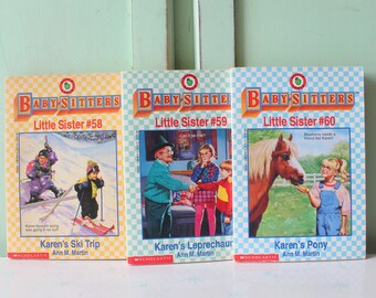 May include: Three paperback books from the "Baby-Sitters Little Sister" series. The books are titled "Karen's Ski Trip", "Karen's Leprechaun", and "Karen's Pony". Each book features a colorful illustration on the cover.