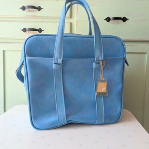 Vintage reiskoffer uit de jaren 1970... retro. vintage bagage. koffer. Jaren 70. mod. twijgje. hip. mode. hipster. blauw. uniseks.