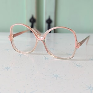 Vintage JACKIE O Glasses......PINK. new old stock. classic. groovy. twiggy. mod. retro glasses. librarian. secretary. woodstock. oversized image 1