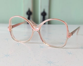 Vintage JACKIE O Glasses......PINK. new old stock. classic. groovy. twiggy. mod. retro glasses. librarian. secretary. woodstock. oversized