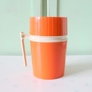 Vintage Orange Thermos: Retro Atomic Kitchen Decor