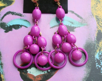 1980s NOS Grape Earrings..costume. 1980s glam. sexy. killer 80s. rad. rocker. punk. indie. hipster. round. geometric. dangly. purple. bright