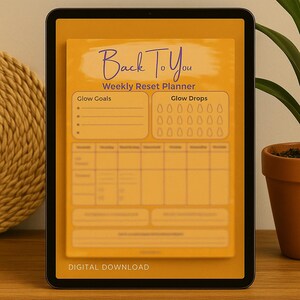May include: A digital download of a weekly reset planner displayed on a tablet. The planner is yellow with the text "Back To You" in a handwritten font. Sections include "Glow Goals" and "Glow Drops", with space for daily and weekly entries. The bottom reads "DIGITAL DOWNLOAD".