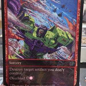 May include: A Magic: The Gathering card named "Vandalblast" with a red border. The card depicts a green and purple robot-like figure in a dynamic scene with explosions and aircraft. The text includes "Sorcery" and the quote "Prepare for extermination!"