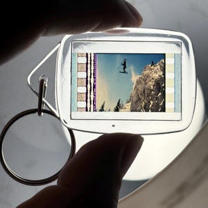 35mm Film Keychain: 007 The World is Not Enough (James Bond jumping off cliff)