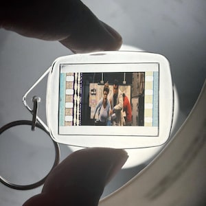 35mm Film Keychain: 007 The World is Not Enough (James Bond and Christmas Jones under fire)