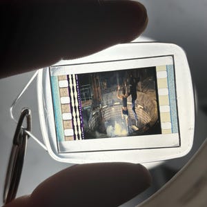 35mm Film Keychain: 007 The World is Not Enough (James Bond and Christmas Jones under fire)
