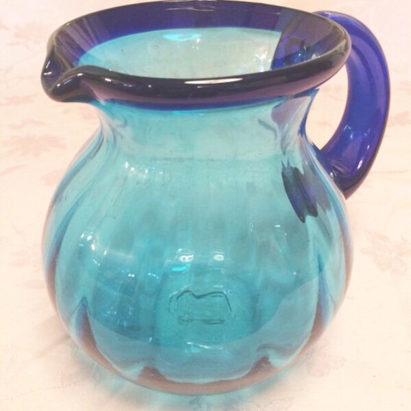 Vintage Turquiose And Cobalt Hand Blown Pitcher Thick Body And Handle. Natural Bubbles in the pitcher. Blue Cobalt Serving Ice Tea Pitcher