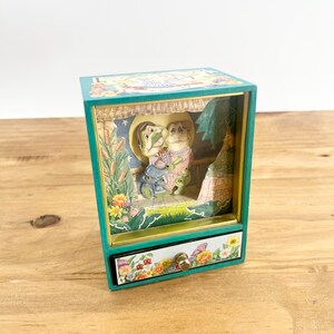 The San Francisco Music Box Company Dancing Paper Doll Music Box