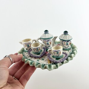 May include: A rustic wooden sign with the text "Welcome to our home" in white lettering. The sign features a distressed finish and a simple, inviting design, perfect for entryway decor.