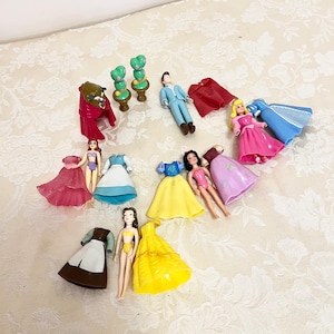 Polly pocket dolls cheap with rubber clothes