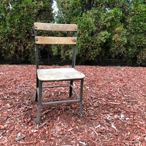 Antique Kids School Chair Metal Frame Wooden Back And Seat In A Drift Wood Finish. With its age. Very Antiqued Small Kids Chair