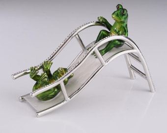 Two Frogs Riding Slide