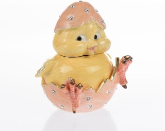 A chick hatches from an egg trinket box