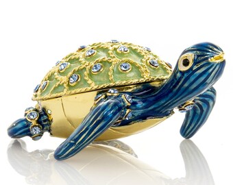 Caja para baratijas con forma de tortuga azul y caparazón dorado