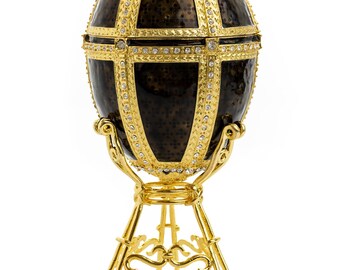 Huevo negro y dorado con un elefante de cristales dorados