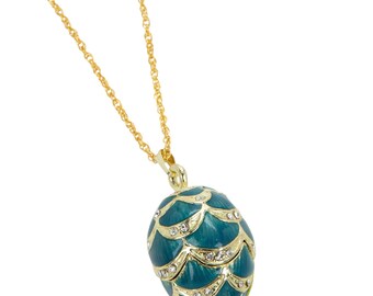 Collar con colgante de huevo dorado y azul claro