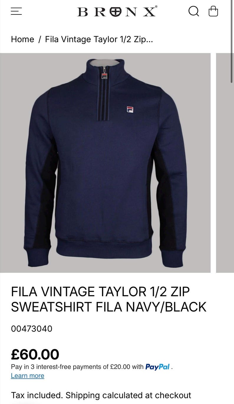 May include: Navy blue Fila Vintage Taylor 1/2 zip sweatshirt. The sweatshirt features a black panel on the sides and a zipper closure. The Fila logo is visible on the chest. The text "FILA VINTAGE TAYLOR 1/2 ZIP SWEATSHIRT FILA NAVY/BLACK" is displayed.