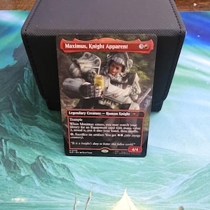 May include: A Magic: The Gathering card featuring "Maximus, Knight Apparent." The card depicts a knight in silver armor holding a drink. The card has a red border and includes game text and a power/toughness of 4/4.