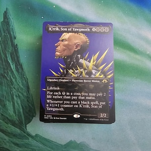 May include: A Magic: The Gathering card depicting K'rrik, Son of Yawgmoth. The card has a dark blue background with an illustration of a bald humanoid with yellow spikes. The text includes "Lifelink" and other game instructions.