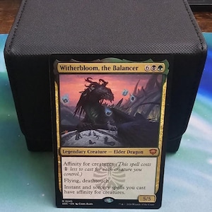 May include: A Magic: The Gathering trading card titled Witherbloom, the Balancer, featuring a dark dragon illustration. The card text includes the name, mana cost, type line Legendary Creature - Elder Dragon, and rules text with a 5/5 power and toughness.