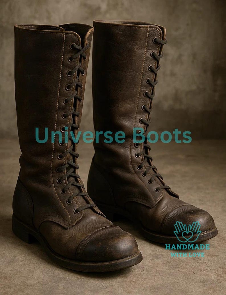 May include: A pair of brown leather knee-high boots with black laces. The boots have a distressed appearance and are labeled "Universe Boots" and "Handmade with Love."