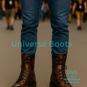 May include: Brown leather boots with a lace-up design and a buckle strap. The boots have a chunky sole and are worn with blue jeans. The text "Universe Boots" is visible in the image. The boots are handmade with love.