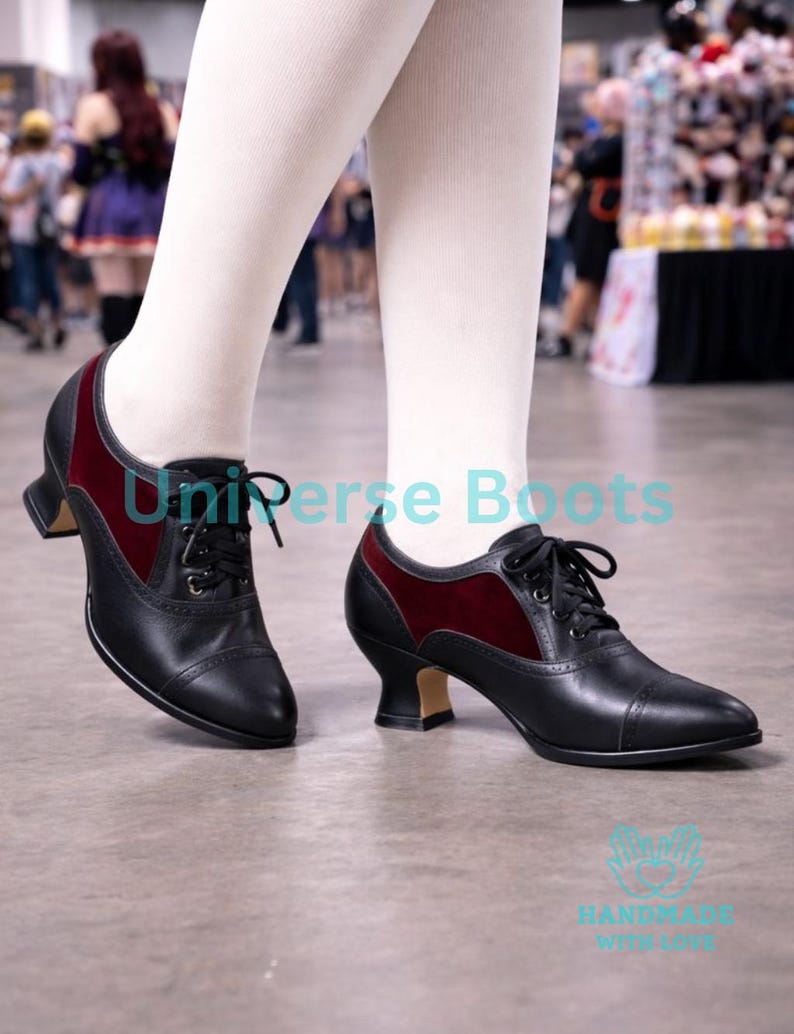 May include: Black and burgundy lace-up shoes with a small heel. The shoes have a leather appearance with a burgundy velvet panel. The text "Universe Boots" is visible on the image.
