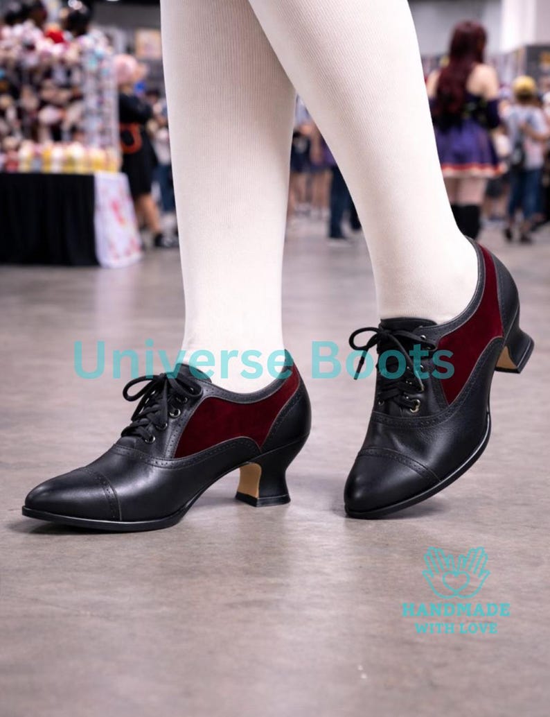 May include: Black leather lace-up shoes with burgundy velvet accents. The shoes have a small heel and a classic design. The text "Universe Boots" and "HANDMADE WITH LOVE" are visible on the image.