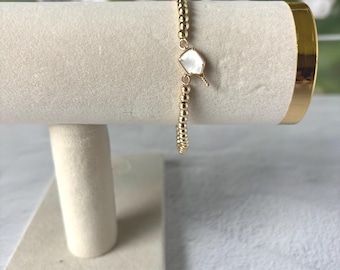 Pulsera de pickleball, chapada en oro, con dije de nácar