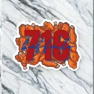May include: A sticker featuring a pile of cartoon chicken wings in shades of orange and brown. The number "716" in red is overlaid on the wings, with the word "Buffalo" in blue script underneath.