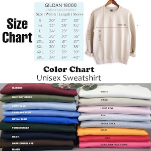 May include: A Gildan 18000 unisex sweatshirt in sand color hangs on a hanger. The image includes a size chart with measurements in inches and a color chart showing various sweatshirt colors like maroon, navy, and light blue.