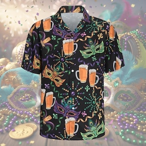 May include: Black button-down shirt with a vibrant Mardi Gras-themed print. The design features beer mugs, masquerade masks, and decorative elements in orange, green, purple, and gold. The shirt has short sleeves and a classic collar.