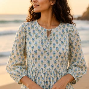Close view of vintage-inspired floral dress, airy and relaxed fit for vacation wear
