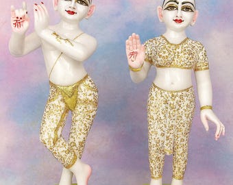 May include: Two white statues of figures with gold and white patterned clothing. The figures stand on green and pink lotus flower bases. The figures have red markings on their foreheads and lips. The text "Vrindavan-Export" is at the bottom.