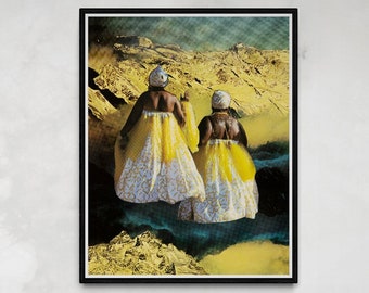 May include: A framed art print featuring two figures in yellow dresses with white patterned skirts, set against a mountainous landscape. The artwork is displayed above a tufted gray velvet sofa with gold trim and decorative pillows.